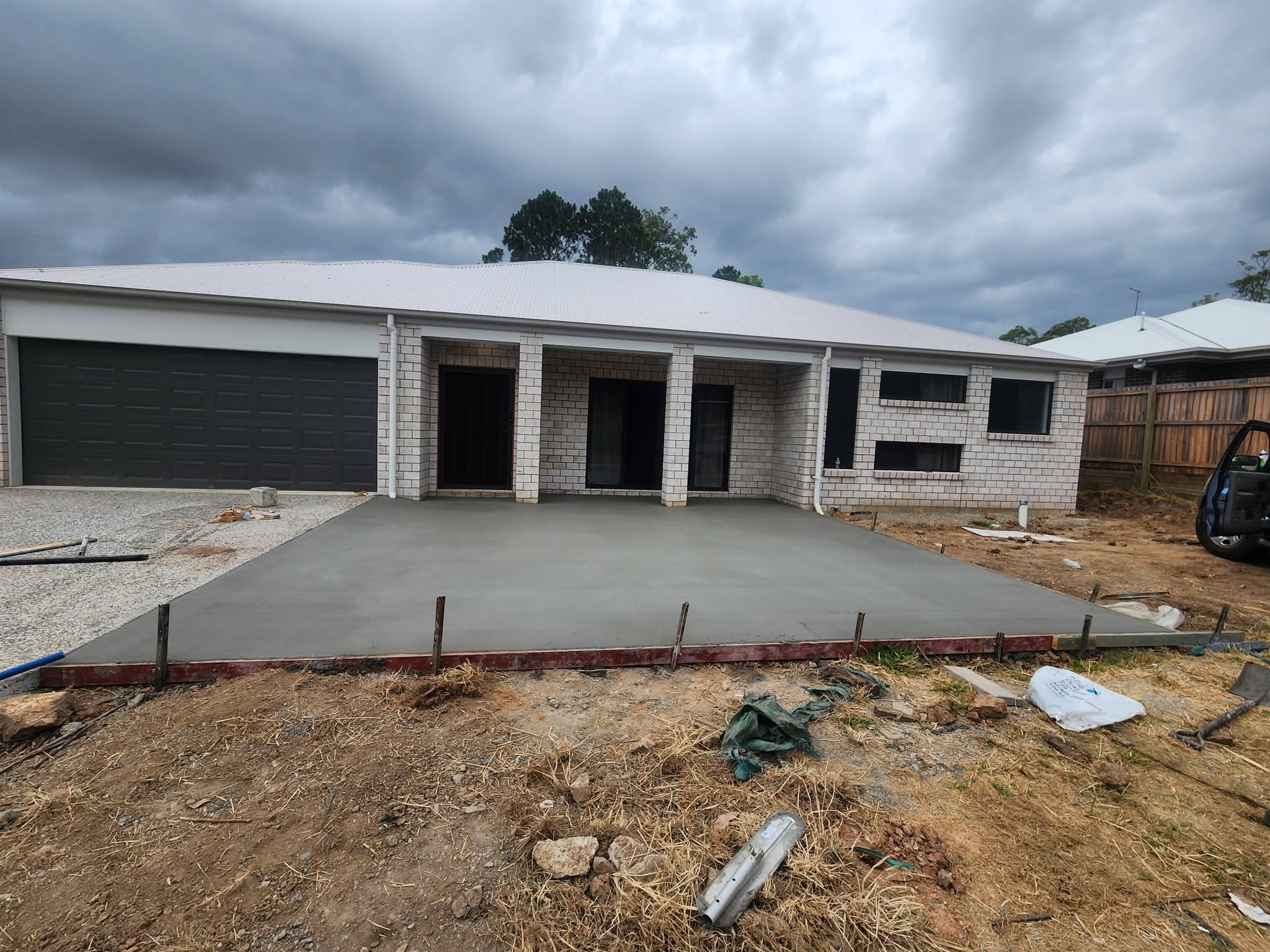 New porch and driveway pour on a brick home